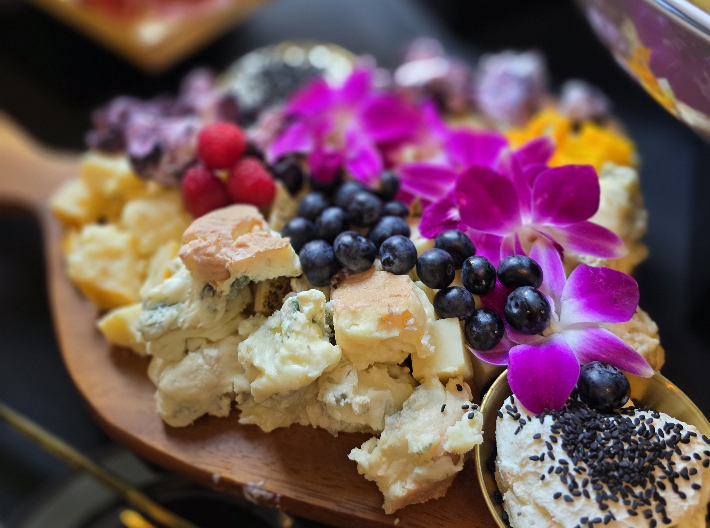 High Touch grazing table with flowers, cheese, fruit, and charcuterie at Human Tech Week 2026